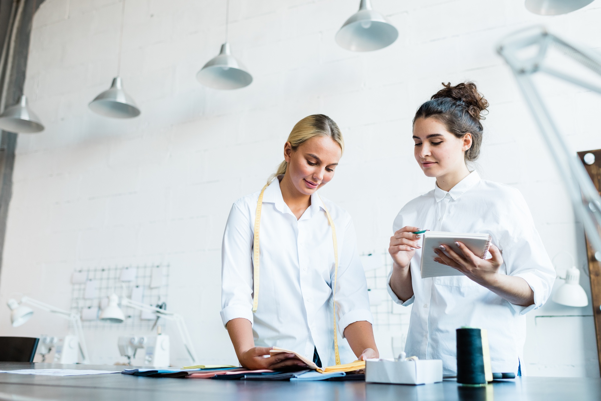 chef consulting with team in modern kitchen